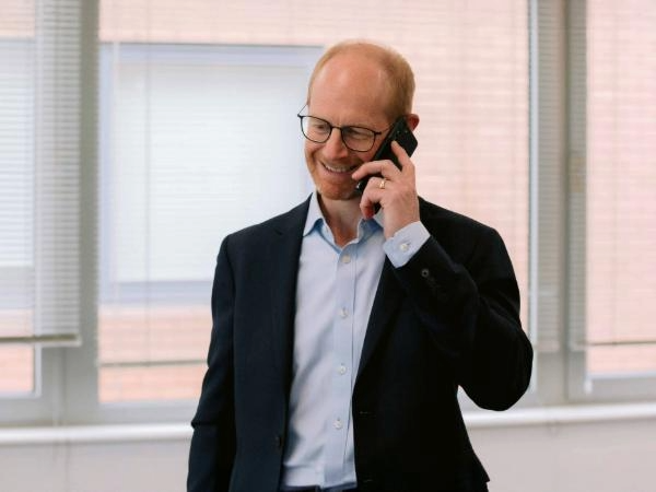 CapEQ partner Douglas Edmunds on phone to a client