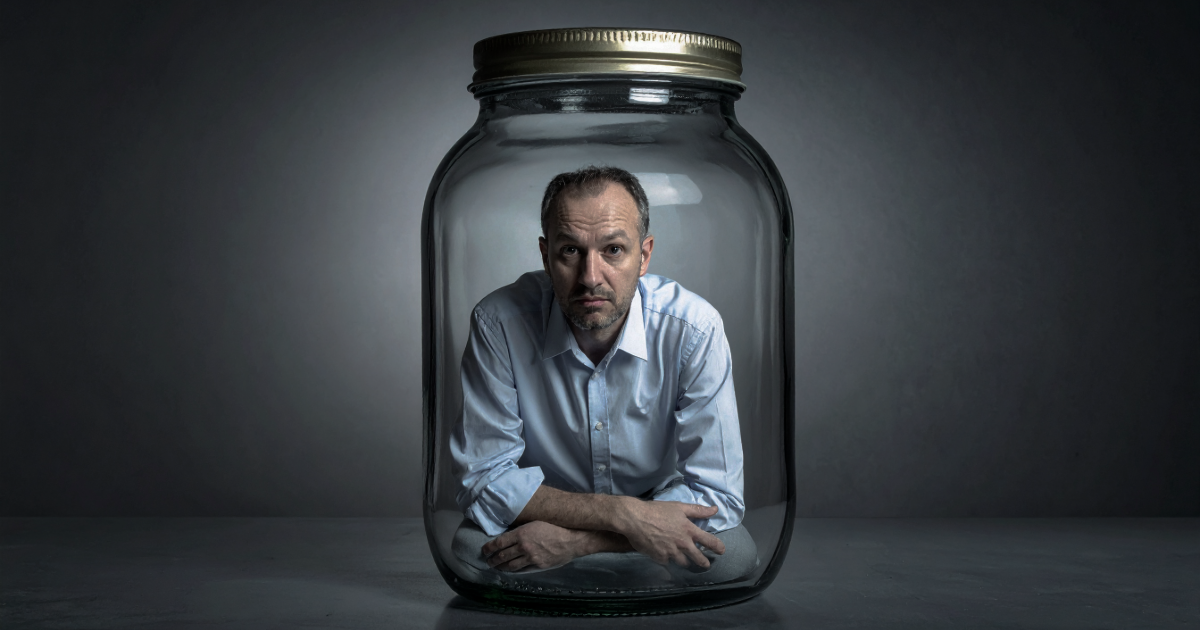 Founder trapped in a jar, visibly stressed — representing business owner burnout and the key-man dependency problem in founder-led exits